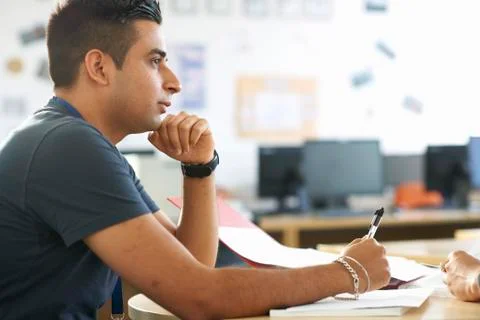Male student having classroom tutorial Foto stock