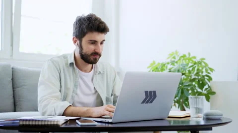 Male student learning at home using laptop Stock Footage 142532553