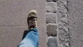Male student legs quickly walking on asphalt road tourist city, active lifestyle HD Footage