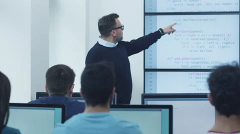 Male Student Raising Hand to Answer a Question During Lecture in Computer Class Stock Footage