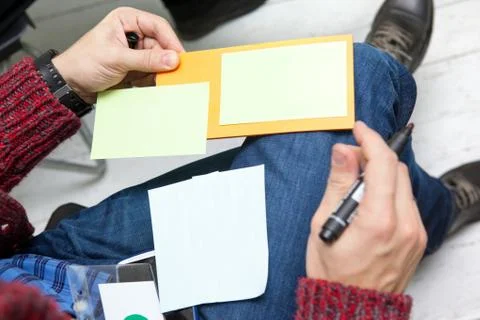 Male student taking notes in classroom. business education concept, casual yo Stock Photos