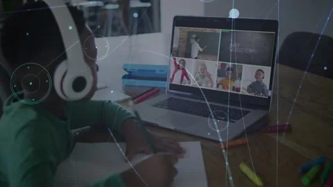 Male student taking notes at home class desk on teacher prompt, HUD drifting Stock Footage 331214016