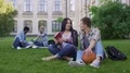 Male student talking and flirting with beautiful Asian girl on college campus 4k or 4k+ Resolution