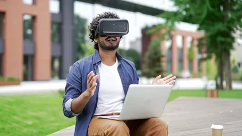 Male student using virtual reality glasses for video call and online chat  스톡 동영상 335148844