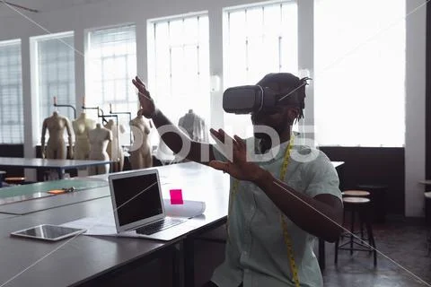 Male student using VR at a fashion college Stock Photos