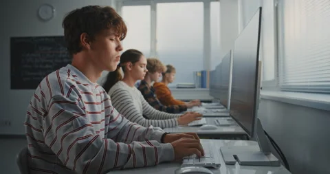 Male Student Working on Game Development Task in Classroom Stock Footage 318517581