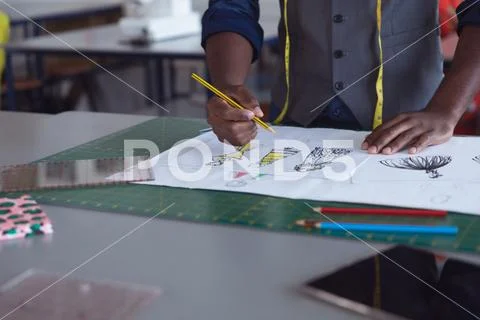 Male student a working on a project at a fashion college Stock Photos