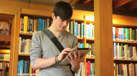 Male student working with a tablet Stock-Footage 8576980