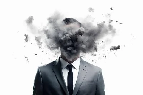 A male in a suit with a head in smoke exploding. Visualisation of the world of Stock Photos