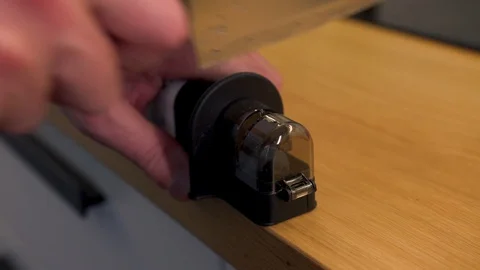 Male sure the knife sharpener in the kitchen Stock Footage 129090750