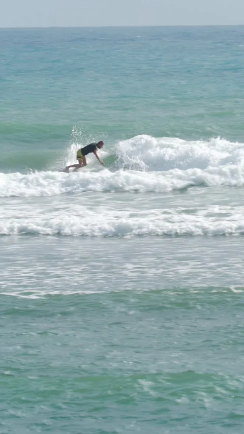 Male surfer in ocean practicing cutback tricks on short surfboard. Stock Footage 279493463
