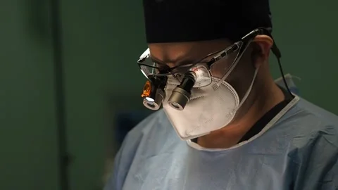 Male surgeon during work in operating room Stock Footage 269341177