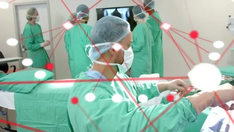 Male surgeon reaching, arranging tools while surgery team viewing scans, node Stockbeeldmateriaal 333602170
