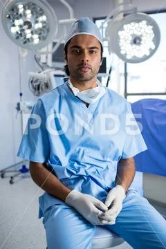 Male surgeon sitting in operation theater Stock Photos