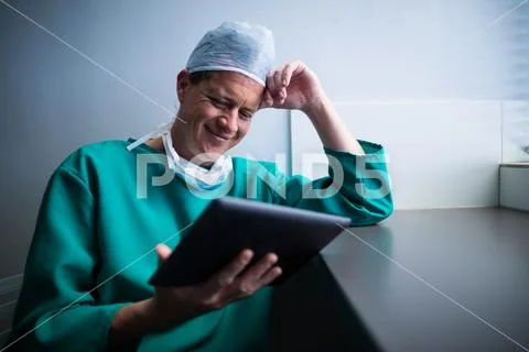 Male surgeon using digital tablet Stock Photos