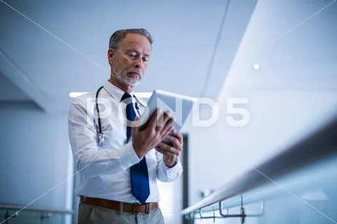 Male surgeon using digital tablet Stock Photos