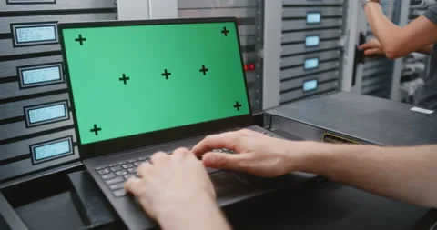 Male System Administrator Working on Green Screen Laptop in Modern Data Center Stock Footage 344967457