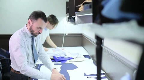 Male tailors working with sketches Stock Footage 68051069