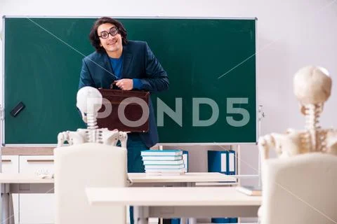 Male teacher and skeleton student in the classroom Stock Photos