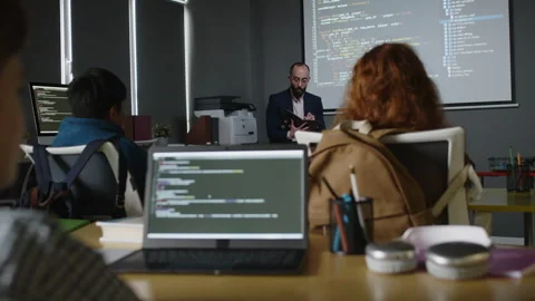 Male Teacher Checking Attendance at Programming Class in School Stock Footage 278124952