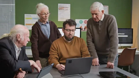 Male Teacher Demonstrating Tasks in Computer Literacy Class Stock Footage 333706009