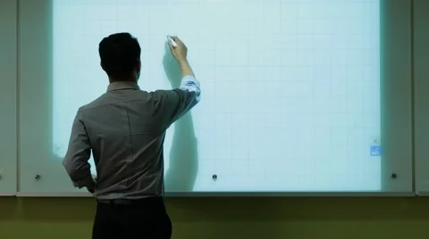 A male teacher drawing a graph Stock Footage
