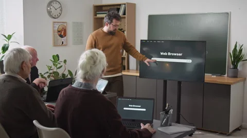 Male Teacher Explaining Internet Basics in Computer Class Stock Footage 333703899