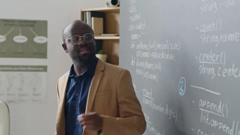 Male Teacher Giving Explanation of Programming Material Stock Footage 244694573