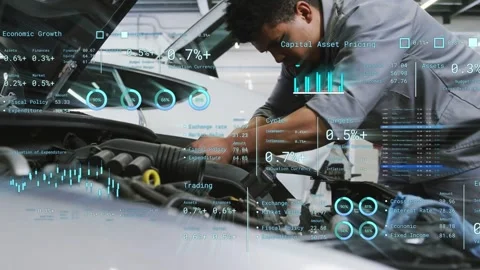 Male tech leaning over engine inspecting in shop, activating AR graphs over Stock Footage 334014004