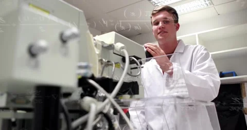 Male tech leaning into scope, tuning knobs at lab while formulas overlaying 스톡 동영상 320585901
