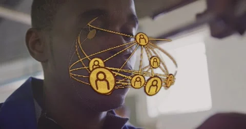 Male tech leaning under bench-tool in lab, aligning part, activating gold node Stock Footage 333963243