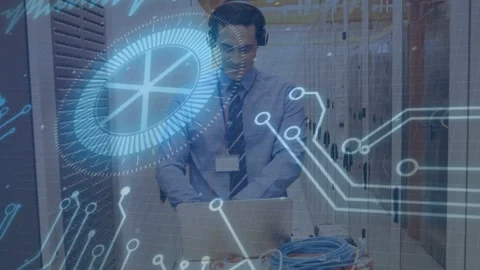 Male tech phoning, starting blue circuit overlay, switching to laptop in rack Stock Footage 335282654