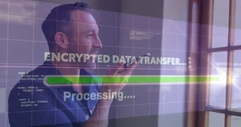 Male tech pro speaking into smartphone, showing encrypted data transfer with Stock Footage 307439134