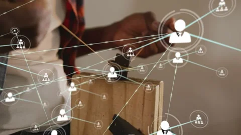 Male tech threading wire on block network icons expanding over hands showing Stock Footage 330195356