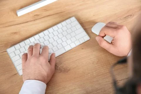Male technical support operator working in office, closeup of hands Stock Photos