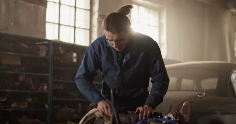 Male technician cleaning engine part Stock Footage 221107165