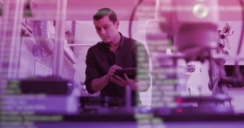 Male Technician Developer Programming Robot in Lab Stock Footage 169577185