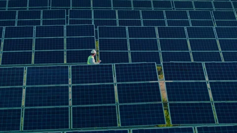 Male technician examining working process of solar panels Video stock 157985182
