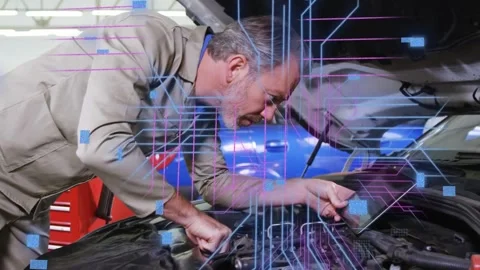 Male technician inspecting engine, holding tablet and activating overlay for Stock Footage 333193408