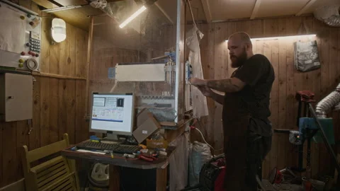 Male Technician Setting Up Computerized Boring Lathe at Small Factory Stock Footage 287526805