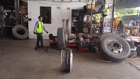 Male Technician Worker Replacing Old Tire With Modern Machine Technology Stock Footage 309306889