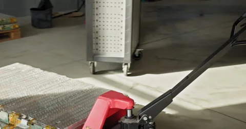 Male Technicians in a Workshop Examining and Handling an Electric Car Battery Stock Footage 277228051