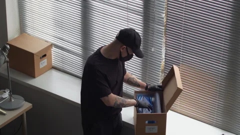 Male Thief Hacking into Office Computer while Partner Searching for Secret Files Stock Footage 313548426