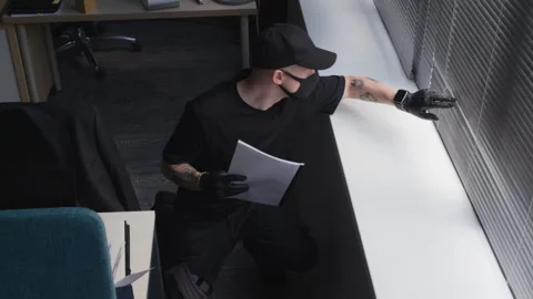 Male Thief Stealing Folder with Secret Corporate Data Breaking into Office Stock Footage 313552985