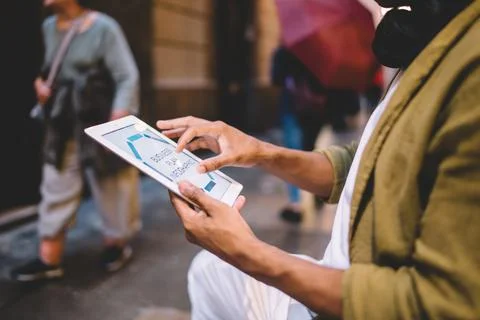 Male with touch pad technology using 4g internet connection for browsing media Stock Photos