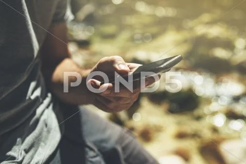 Male tourist using mobile smart phone for GPS navigation Stock Photos