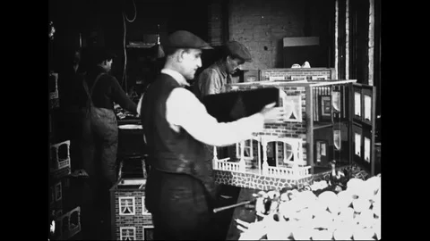 Male Toy Factory Worker Assembling Wooden Doll House Stock Footage 114762659