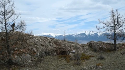 Male trail runner exercising outdoors by rocky climb. Healthy active lifestyle Stock Footage 103140249