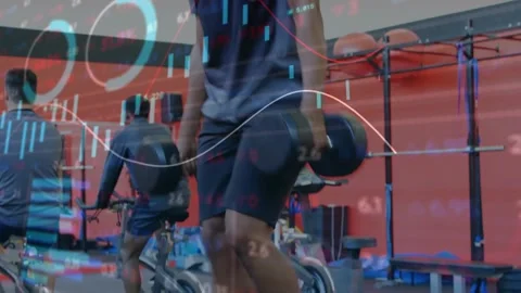 Male trainee picking dumbbell, doing stepups in gym, building power while Vídeos de archivo 331084749