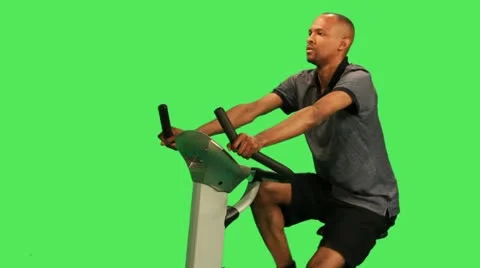 Male training on exercise bicycle Stock Footage 12159010